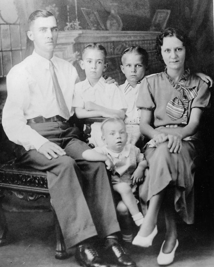 This distinguished family portrait is of the Bill Joe Orr family.  Pictured, left to right, is Bill Joe Orr, Howard Orr, Bobby Joe Orr, Ester Bell Orr, with Wylie Orr in the middle.  Bill Joe built the house located just as you turn off Alabama Highway 229 on to Andrews Mill Road.  at 46 Andrews Mill Road, today occupied by Bart and Ellen McManus.  He sold it to T. I. and Annie Beulah Cotton in the 1940's and moved his family to Palm Harbor, Florida.  Bobby Joe moved back to Red Hill after about 25 years in Florida.  Bill Joe and Ester Bell returned to this area after about 30 years.  Howard and Wylie remained in Florida until their deaths. All this family is gone now but they were a great part of early Red Hill. 