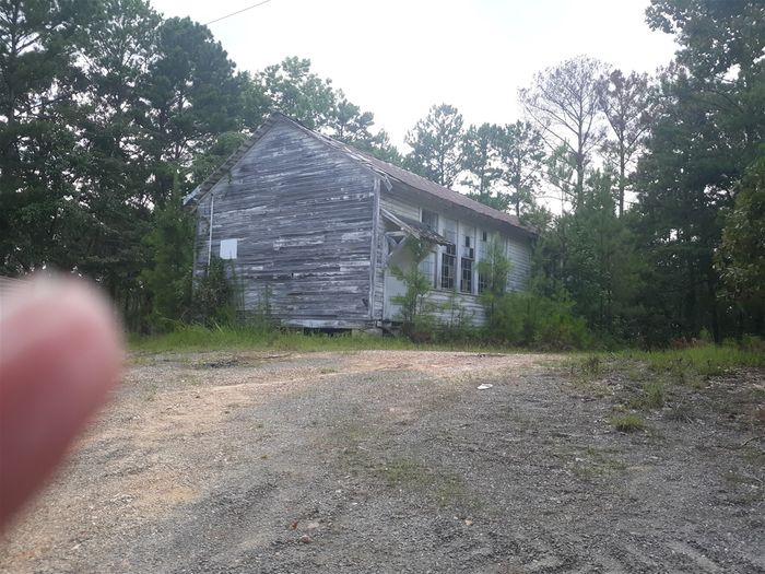 This old school building was built about the same time as the Red Hill School, circa 1927, by Julius Rosenwald, as a school for black children on the north side of Lake Martin.  It was one of about 5,000 school buildings built for black children around the south to help them hard times the Jim Crow laws in the south were putting on the facilities for educating black children.  It was closed when the local schools were desegregated. The area where it is located used to be called Benson, after John Benson, a local former slave entrepreneur who made many improvements for black people in this area.